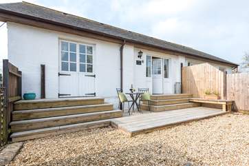 The enclosed patio-area is ideal for outdoor dining.
