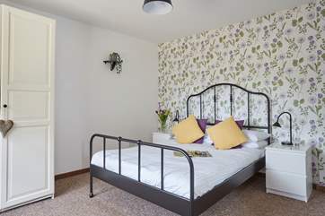 The master bedroom has access to the patio.