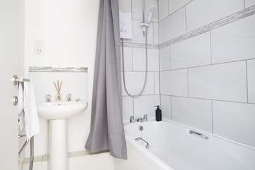 The modern bathroom and fitted shower.