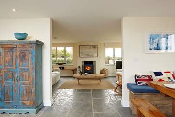 Let the open plan rooms be warmed by the large multi-burner.
