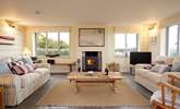 Light the fire and relax in comfort in the stunning sitting-room. - Thumbnail Image