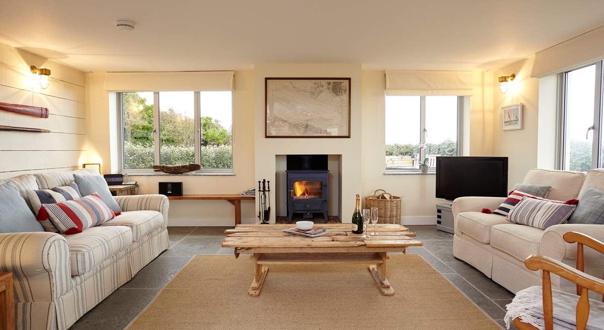 Light the fire and relax in comfort in the stunning sitting-room.