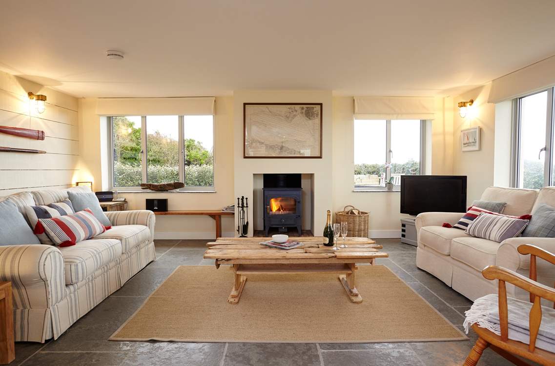 Light the fire and relax in comfort in the stunning sitting-room.