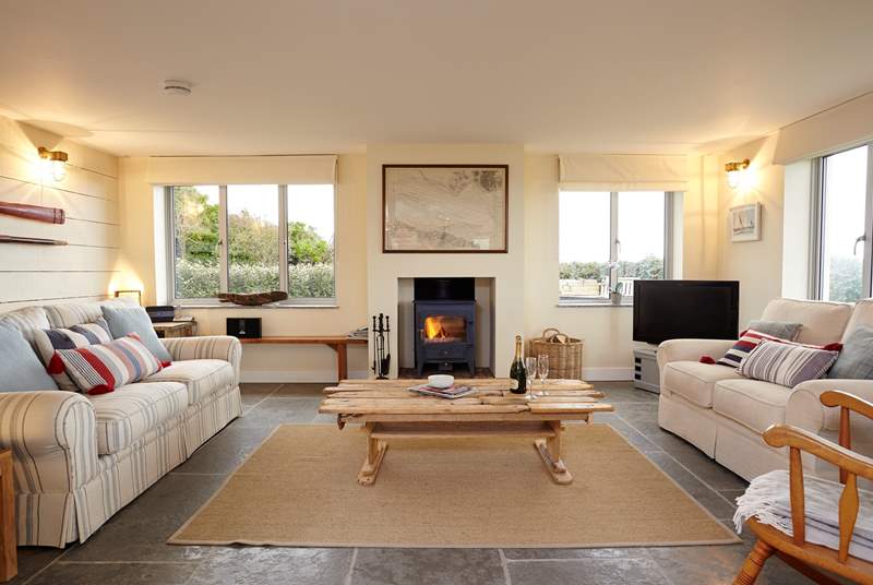 Light the fire and relax in comfort in the stunning sitting-room.