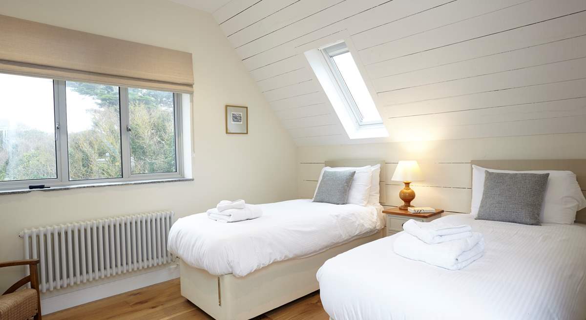 The light twin bedroom is a delight for children.