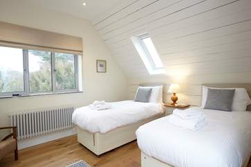 The light twin bedroom is a delight for children.
