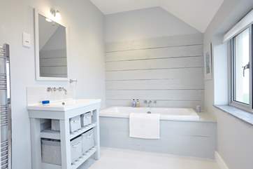 Have a relaxing bubble bath, with a view out to the cliffs.