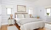 The lovely second double bedroom with views across the water. - Thumbnail Image