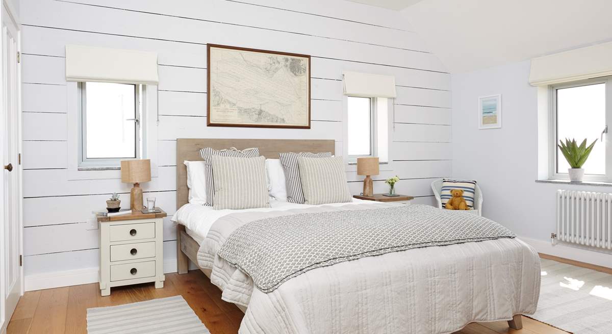 The lovely second double bedroom with views across the water.