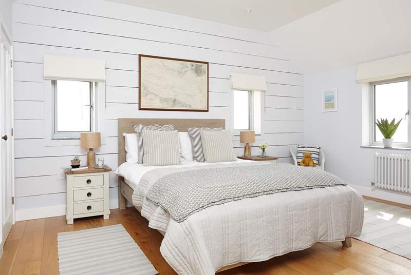 The lovely second double bedroom with views across the water.