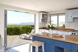 Open up the bi-fold doors, let the summer air in and enjoy a spot of lunch looking out across the sea, towards the white cliffs of Freshwater.