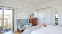 Why not have breakfast in bed and open the balcony doors to let in the morning breeze.