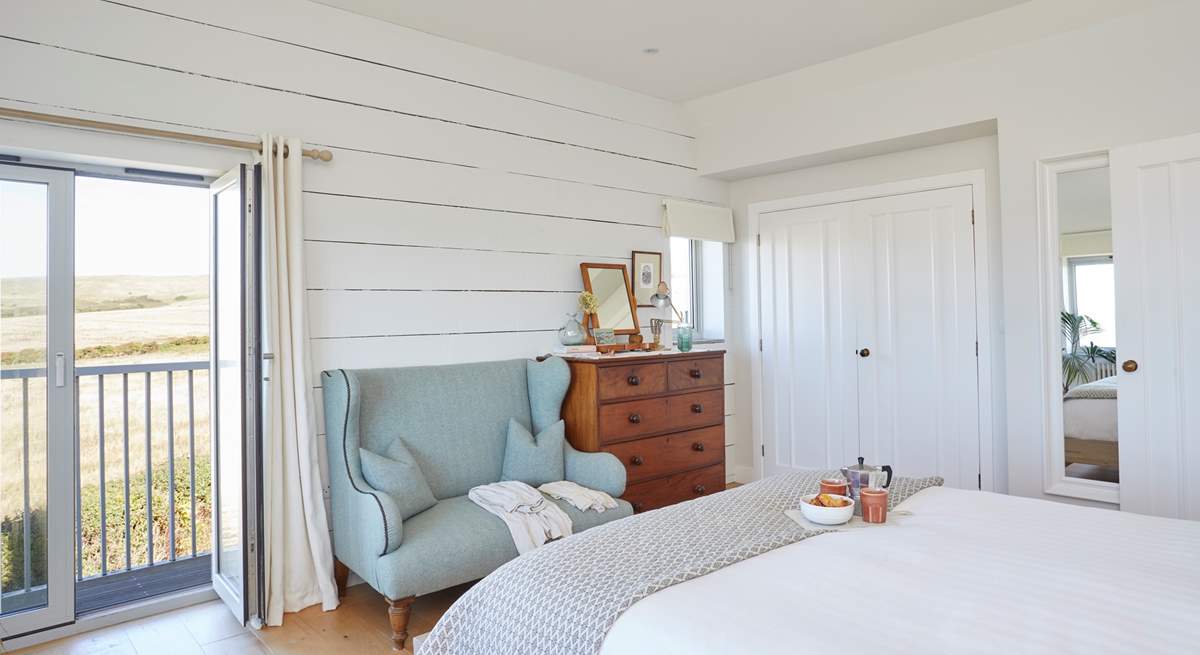 Why not have breakfast in bed and open the balcony doors to let in the morning breeze.