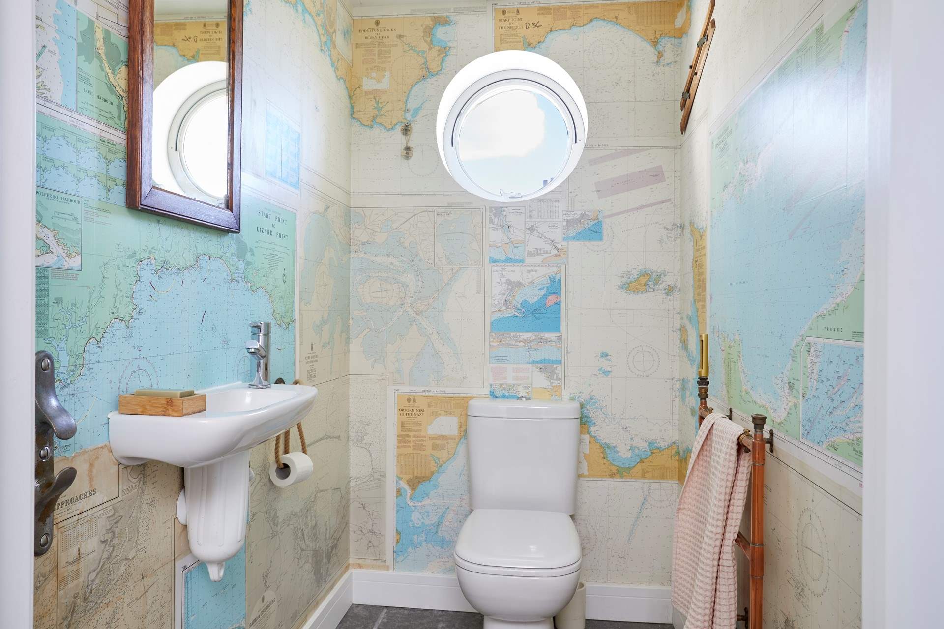 The ground floor cloakroom has rather quirky wallpaper.