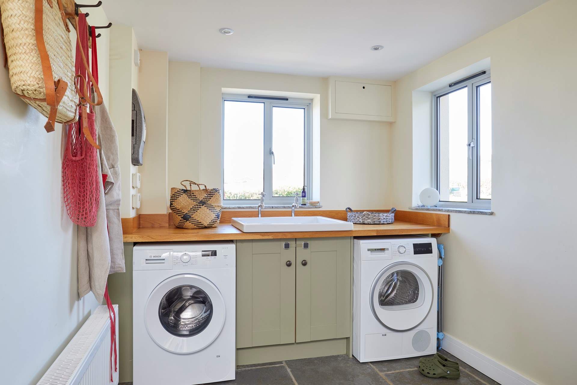 The handy utility-room with washing machine and tumble dryer.