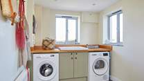 The handy utility-room with washing machine and tumble dryer.