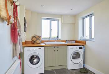 The handy utility-room with washing machine and tumble dryer.