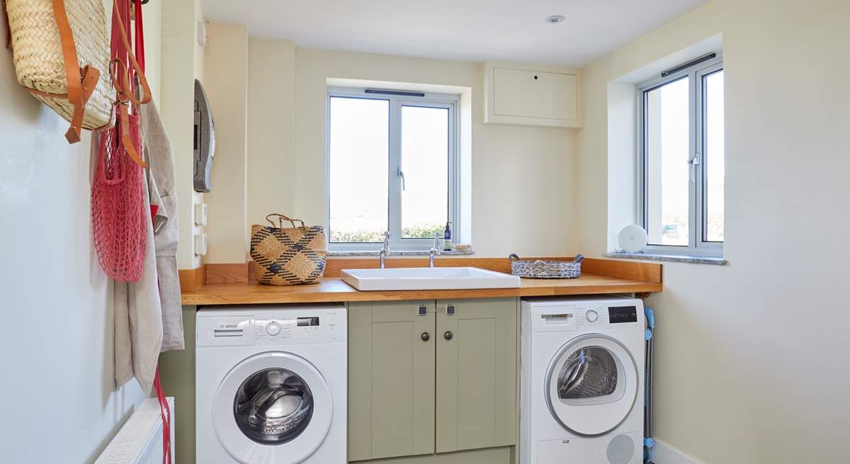 The handy utility-room with washing machine and tumble dryer.