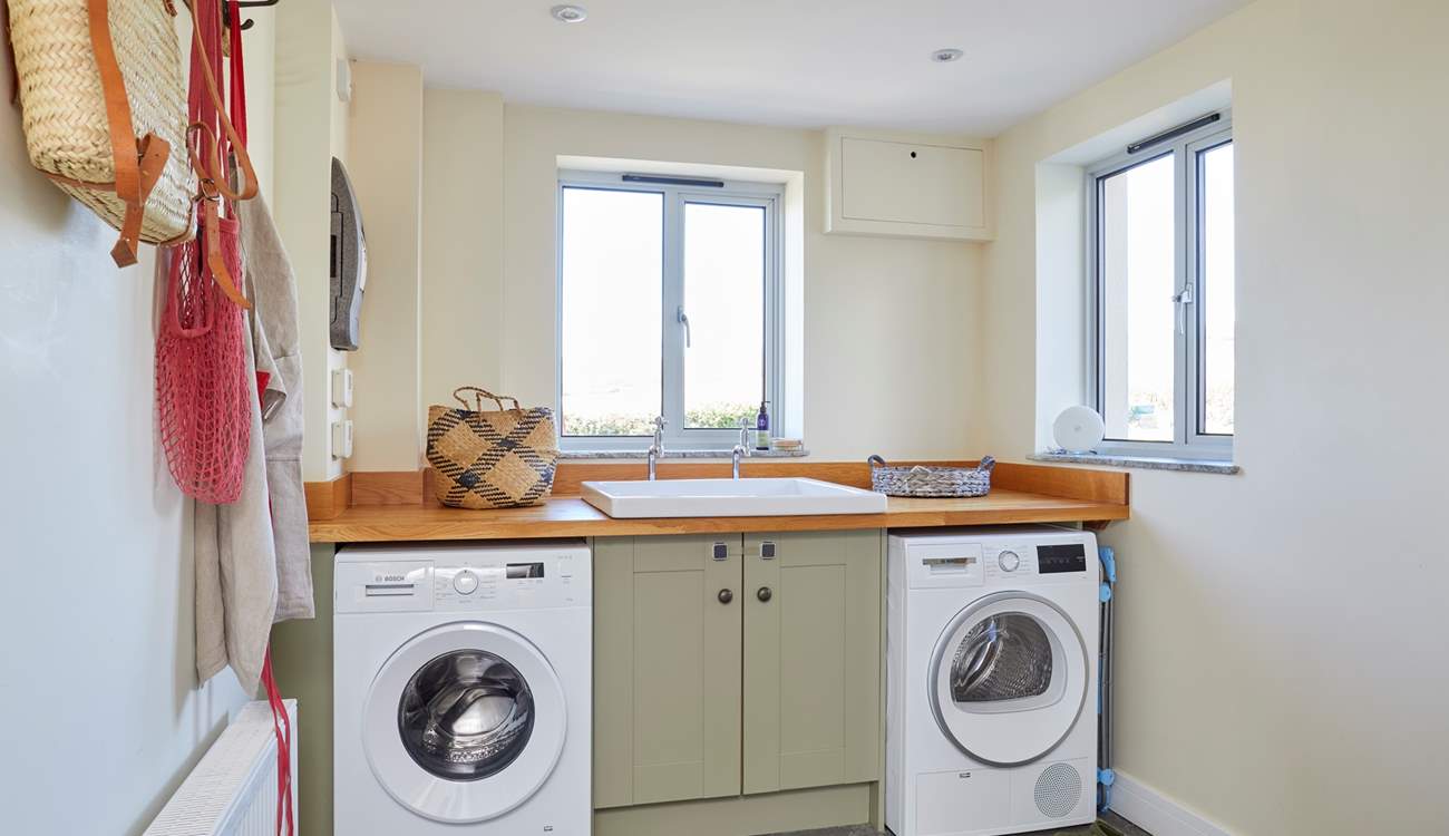 The handy utility-room with washing machine and tumble dryer.