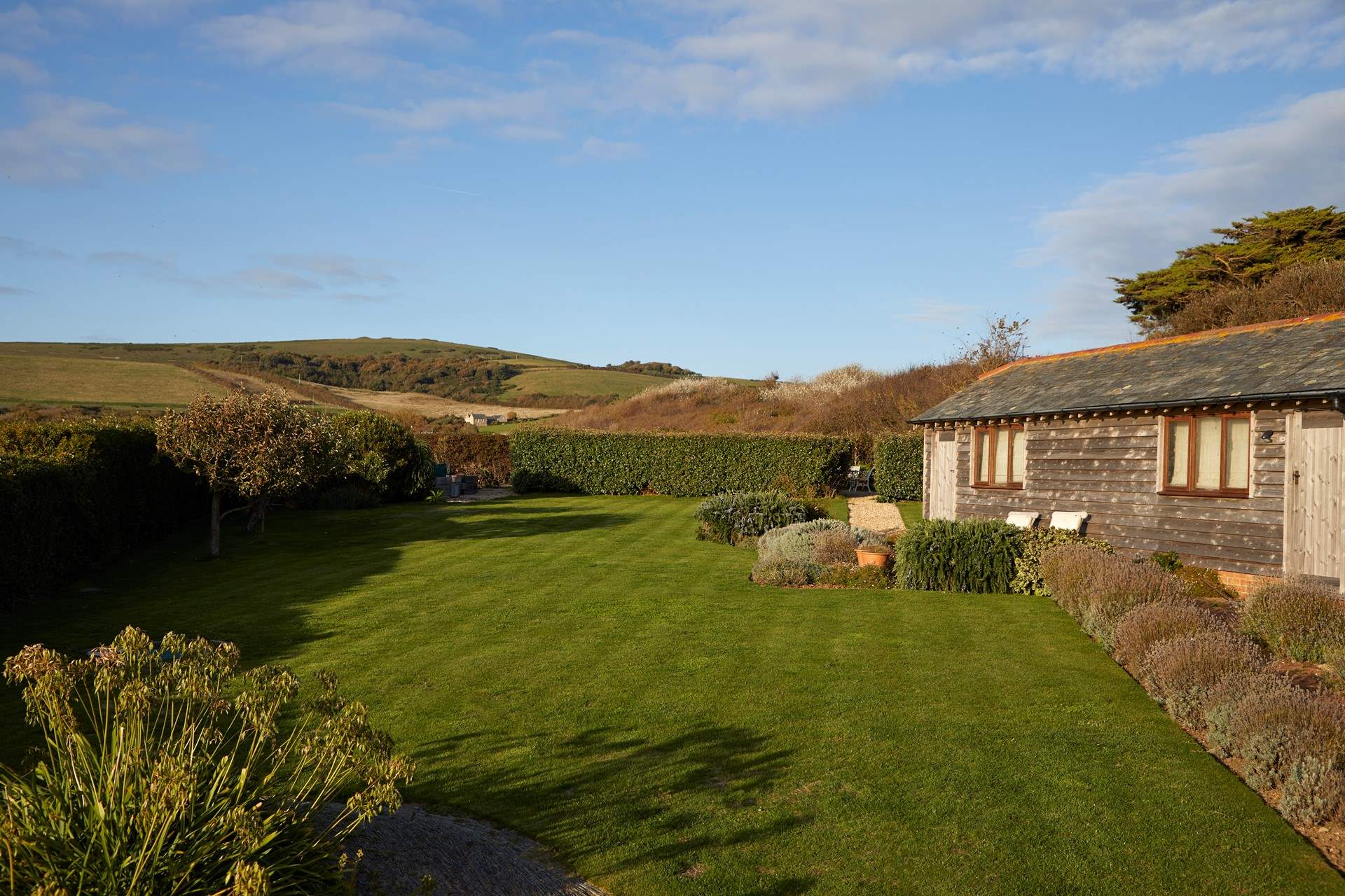 The lawn area is a great place for some garden games or for the family dog to enjoy. 