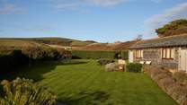 The lawn area is a great place for some garden games or for the family dog to enjoy. 