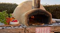 Try your hand at freshly made pizza, enjoyed sitting in the sunshine. 