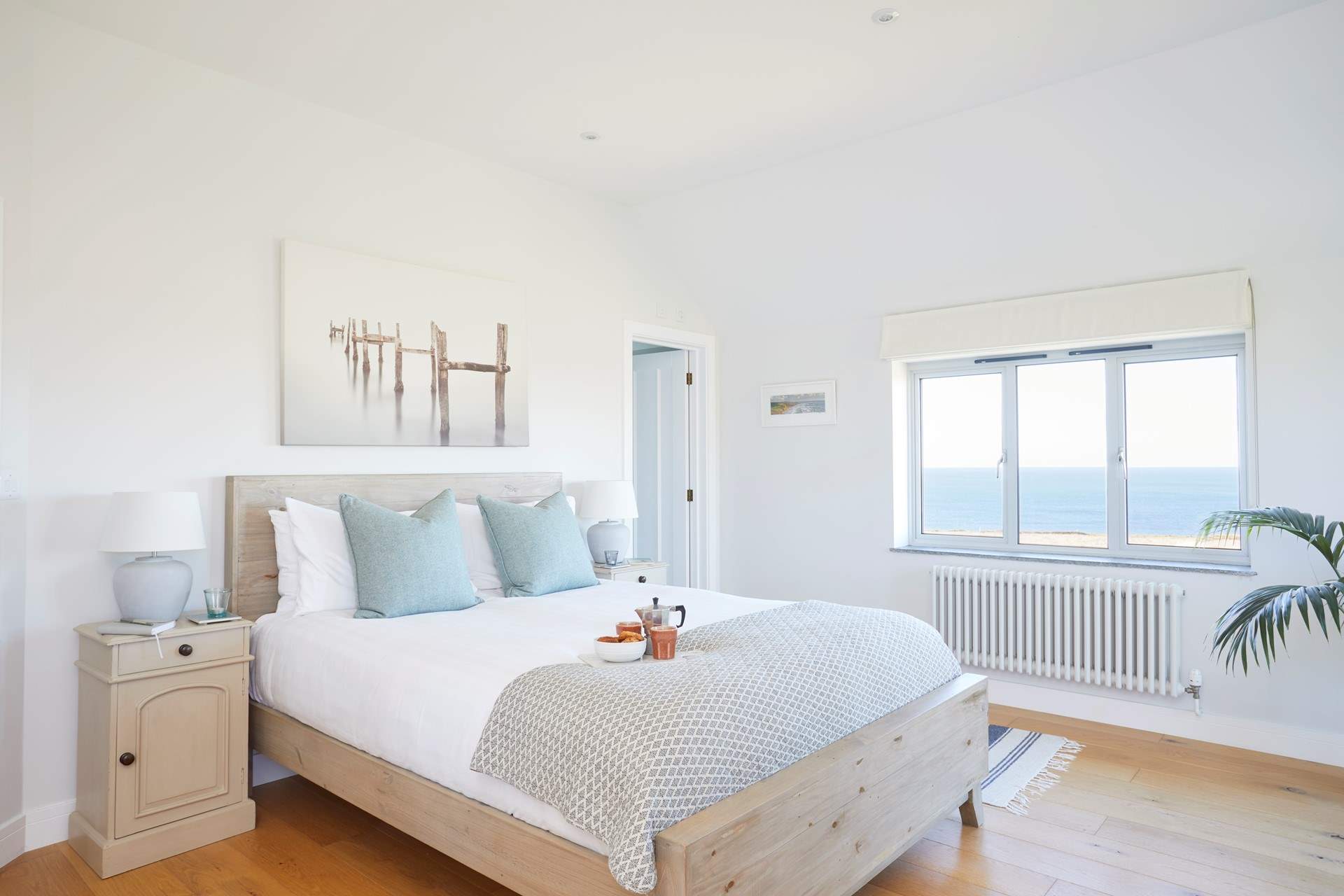 Bedroom 1 is beautifully furnished in pastel shades for a restful night. 