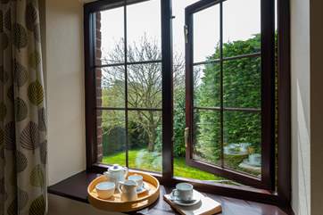 The bedroom looks over the garden.