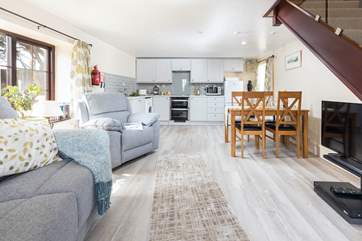 The cosy open plan living area is light and bright.