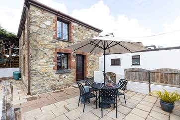 Perfect for al fresco dining, sit and relax on the patio.