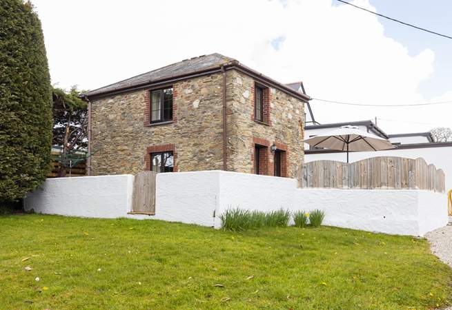 Charming Nanteague Cottage is set to the side of the courtyard shared with Nanteague House.