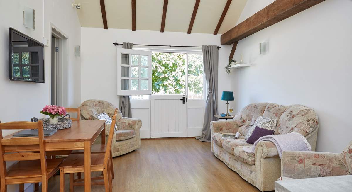 Vaulted ceiling with wood beams gives the cottage a light airy feel.