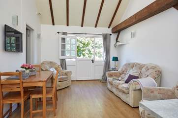 Vaulted ceiling with wood beams gives the cottage a light airy feel.