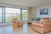 The extremely spacious living-room with direct sea views is the place for relaxation.