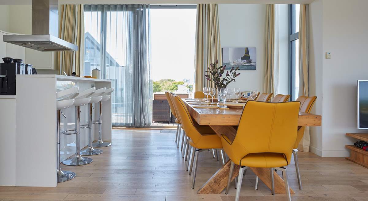 The gorgeous open plan kitchen and dining area has double-height bi-folding doors leading out on to the external decking, with panoramic Solent views.