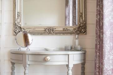 There is even a dressing-table with lovely little touches.