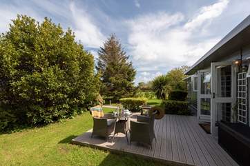 The decked patio area also has a fire-pit barbecue.
