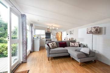 The comfortable L-shaped sofa, perfect for cuddling up in front of the wood-burner on.