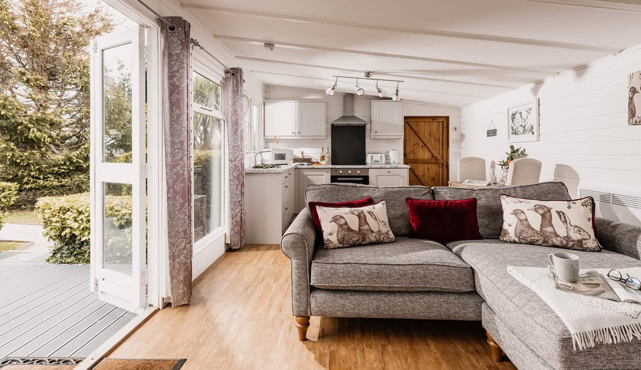 The cosy living space opens out onto the patio.