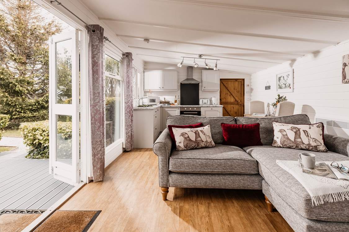 The cosy living space opens out onto the patio.