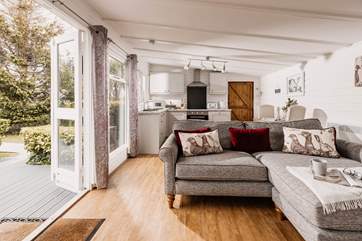 The cosy living space opens out onto the patio.
