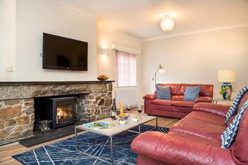 Plenty of room to unwind and relax in front of the wood-burner.
