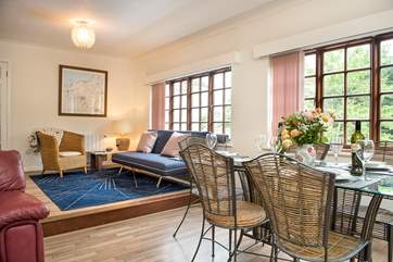 There is a second sitting-area opposite the kitchen - so you can keep the 'chef' entertained whilst they cook up a treat or two. Please note there is a step down to the dining area