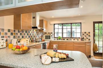 From the kitchen you lead out to the back garden, games-room and utility-area.