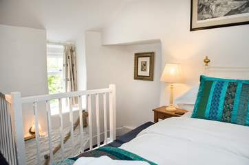 The open stairs from the living-room lead up to the first floor bedroom.