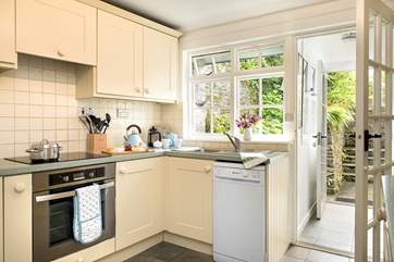The corridor from the kitchen leads to the twin bedded room. The steps take you up to the garden.