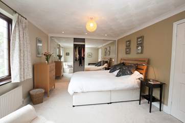 Take a peek at the sea from the spacious master bedroom with king-size bed and en suite shower-room.