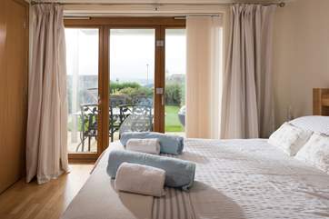 Bedroom 1 is on the ground floor and has patio doors out to the garden and sitting-area.