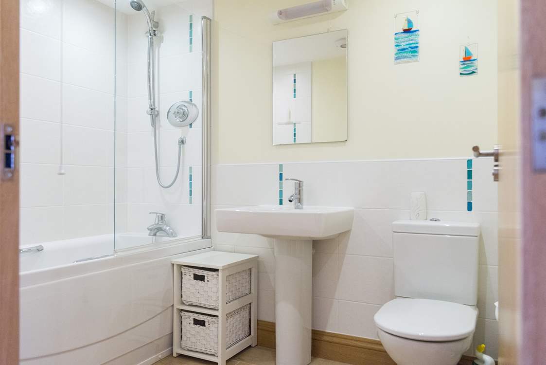 The family bathroom separates Bedroom 1 and Bedroom 2.