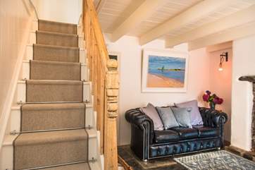 The cottage stairs lead off from the sitting-room.